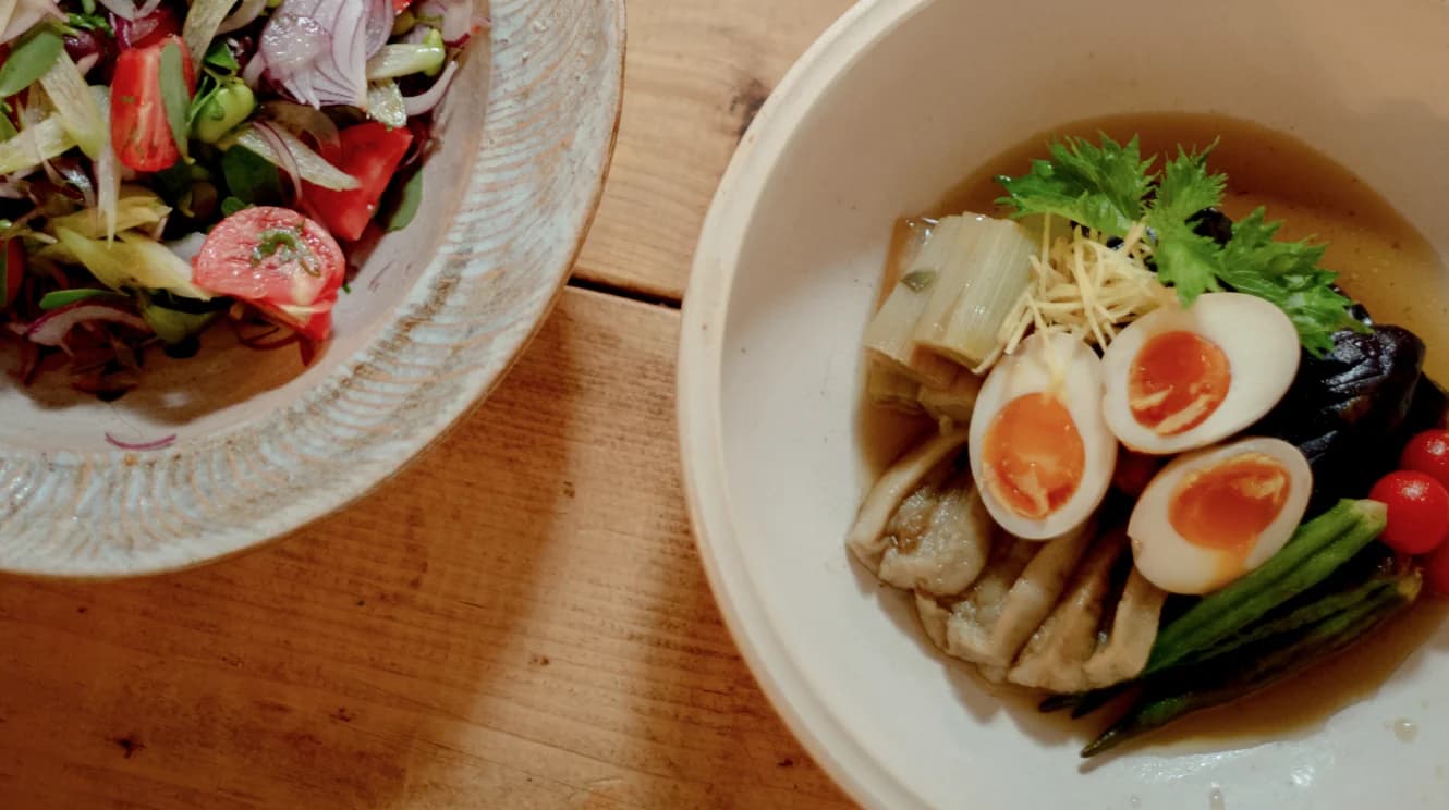 Finished ceramic pieces displayed on wooden shelves