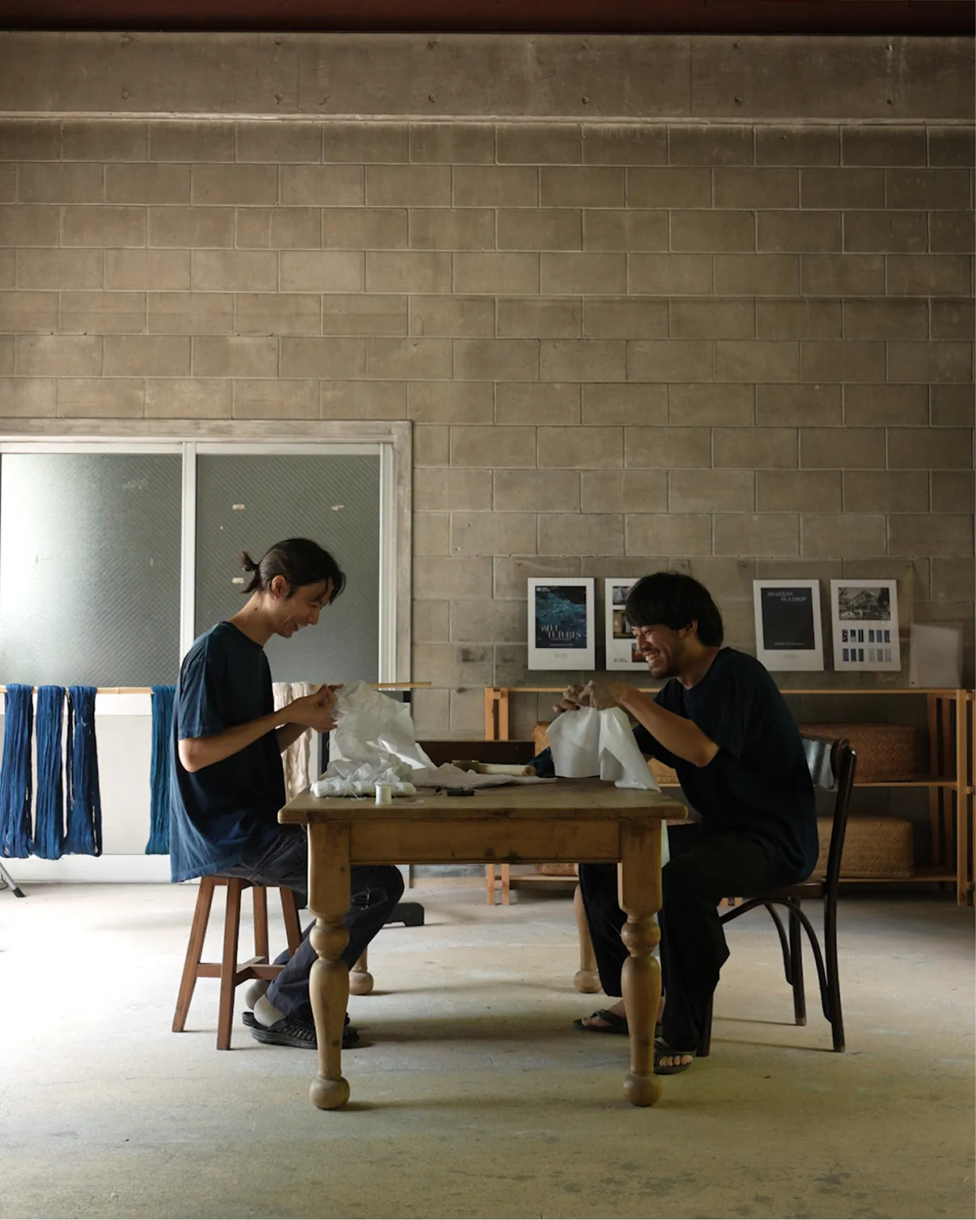 Artist stitching shibori patterns by hand