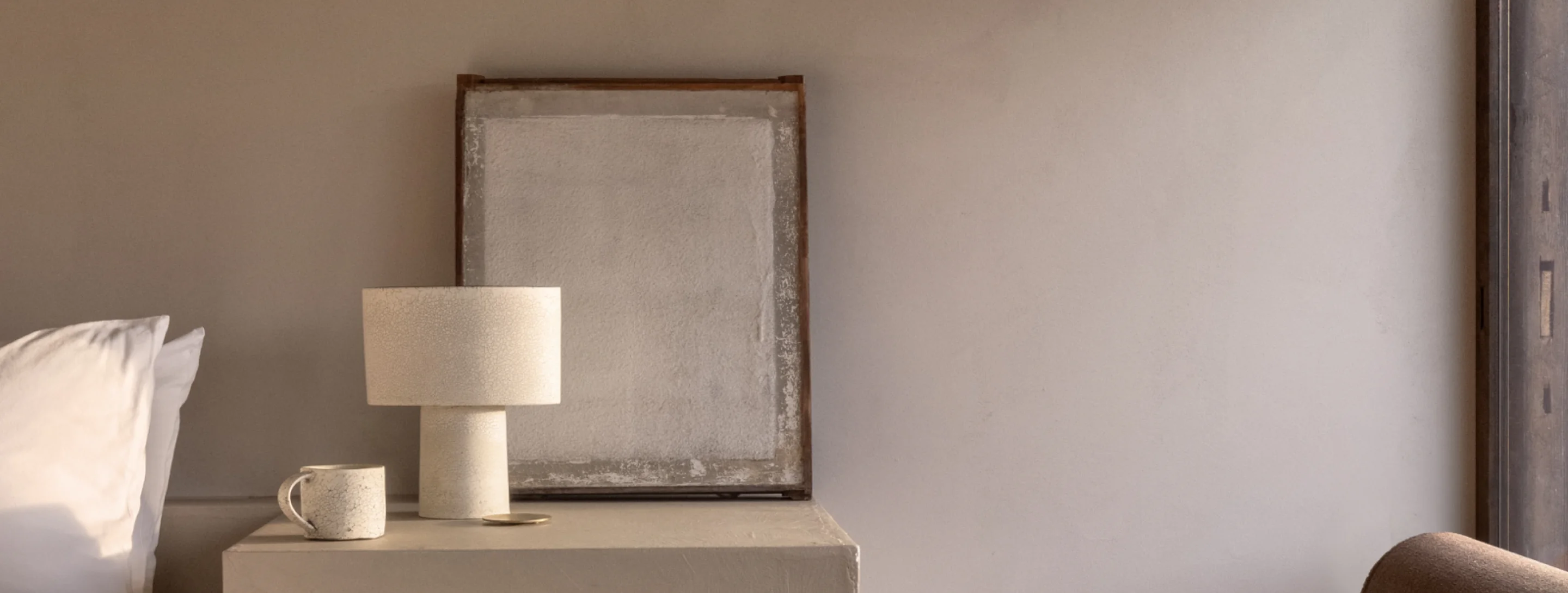 Suite 1 bedside lamp, cup and framed artwork
