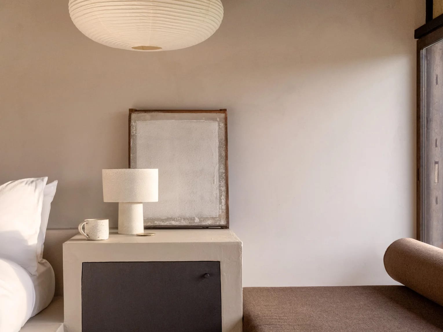 Suite 1 bed, bedside lamp and sofa